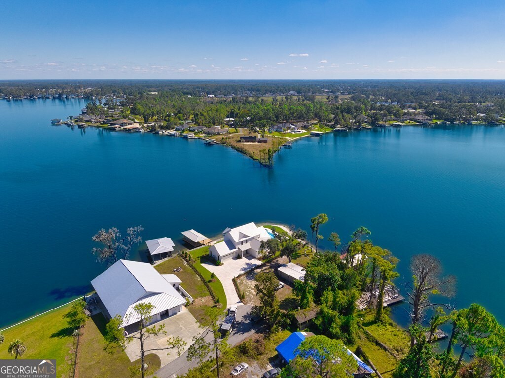 5909 Travis Trail Lake Park, GA 31636 - Photo 35 of 46 an aerial view of a house with a lake view
