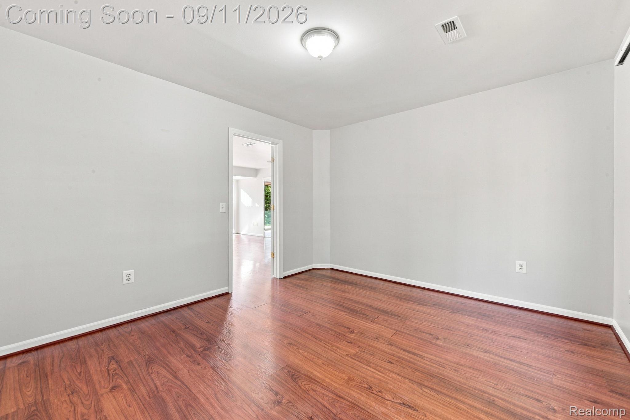 3201 Lynhurst Court Rochester, MI 48306 - Photo 32 of 43 Bright, open room featuring rich wood-finish flooring, clean white walls, and recessed ceiling lighting
