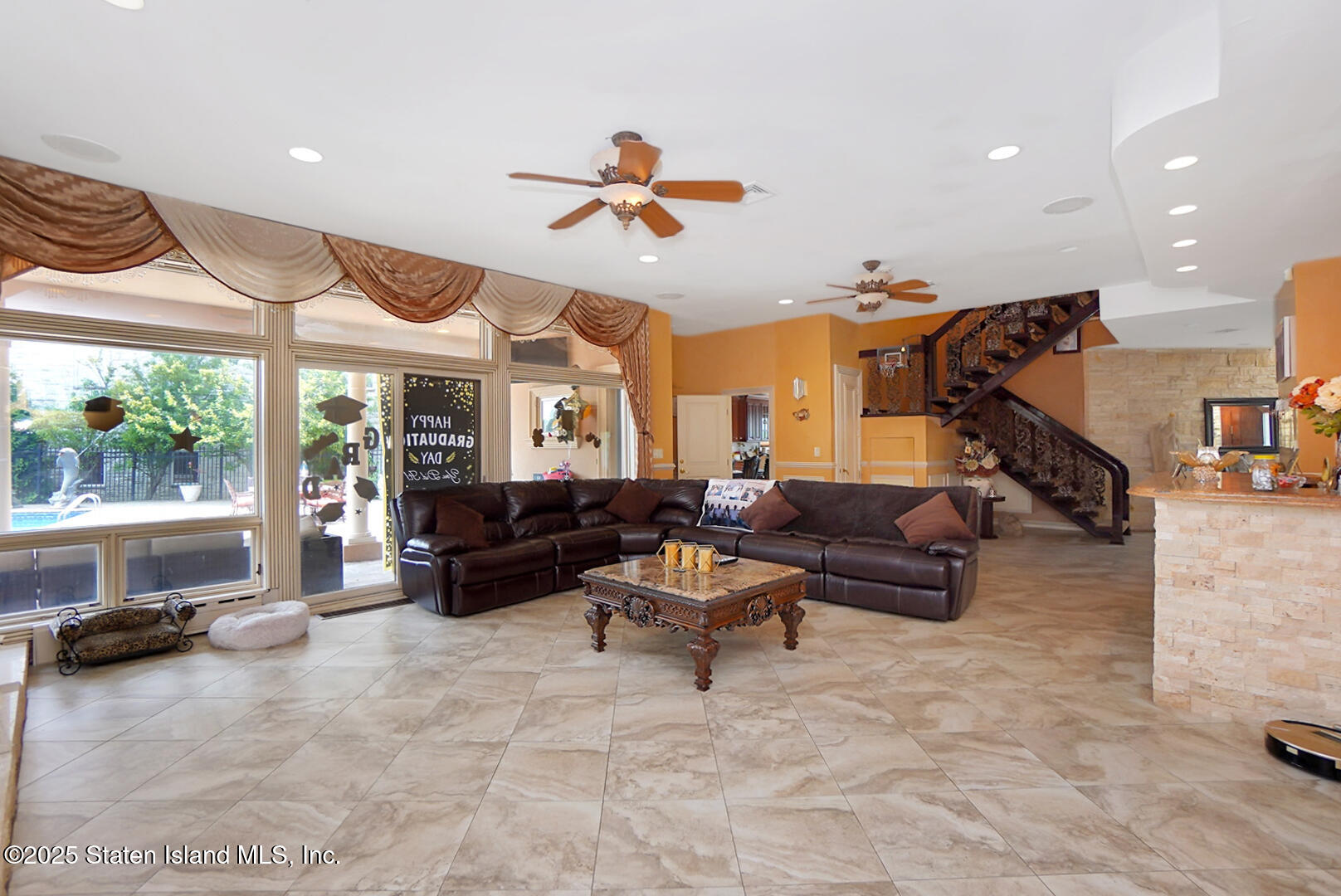 545 Arbutus Avenue Staten Island, NY 10312 - Photo 12 of 57 a living room with furniture and a large window