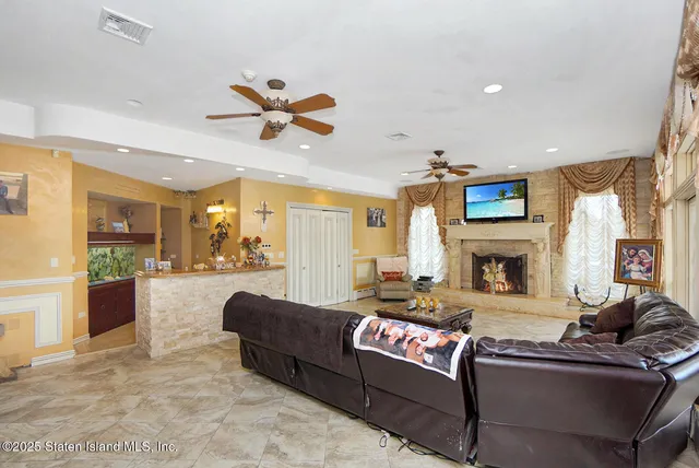 a living room with fireplace furniture and a fireplace