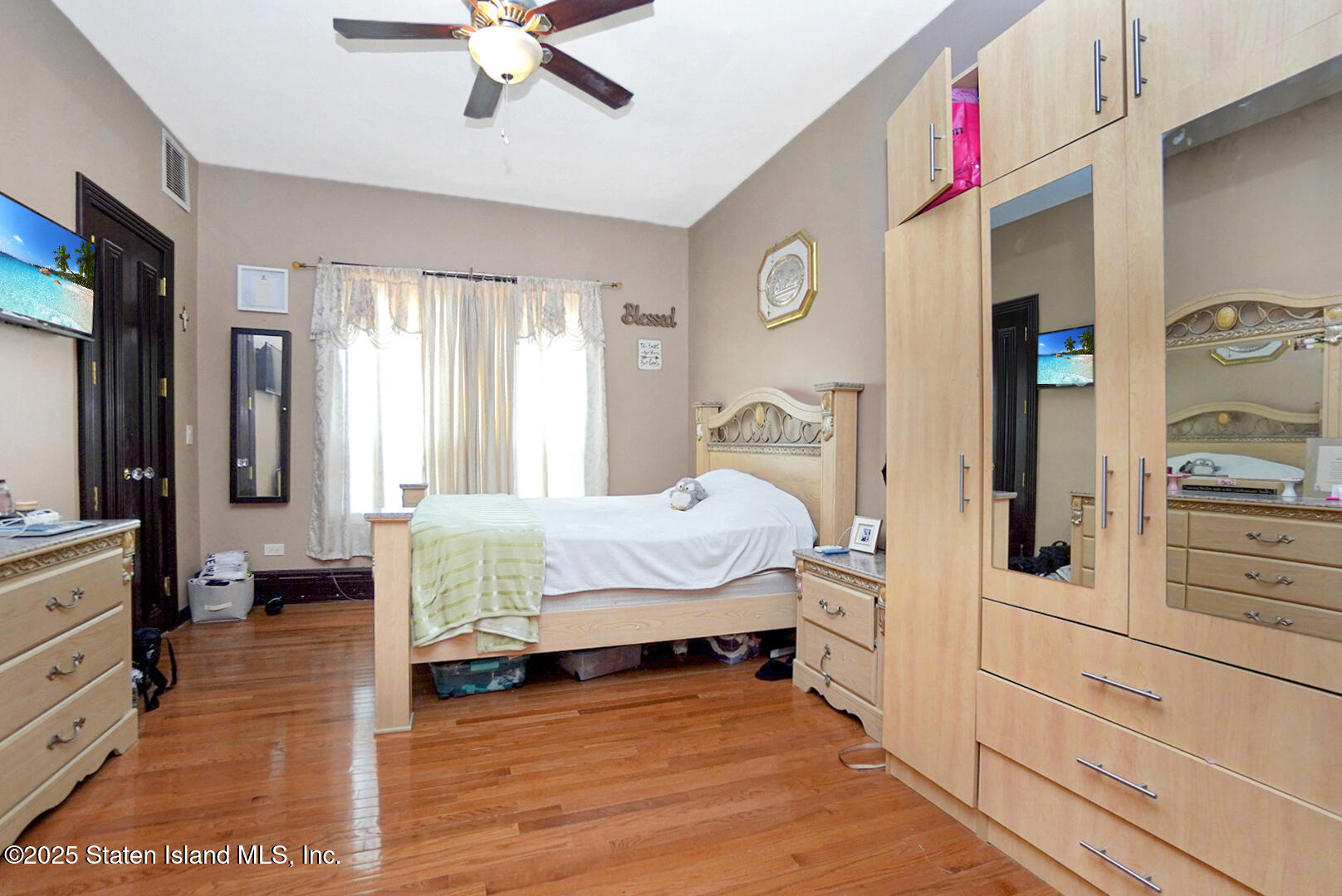 545 Arbutus Avenue Staten Island, NY 10312 - Photo 16 of 57 a bedroom with a bed and a large window