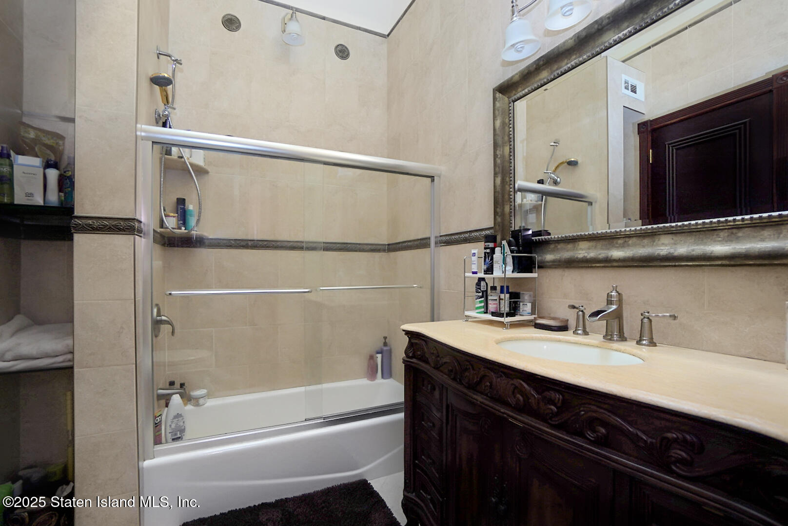 545 Arbutus Avenue Staten Island, NY 10312 - Photo 18 of 57 a bathroom with a bathtub and a sink