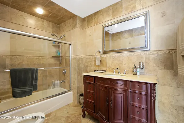 a view of a patio with dining table and chairs with a barbeque grill and plants