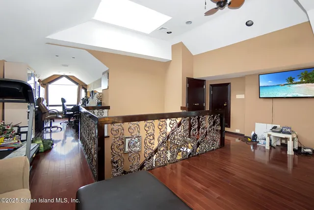 a view of living room with furniture and a flat screen tv