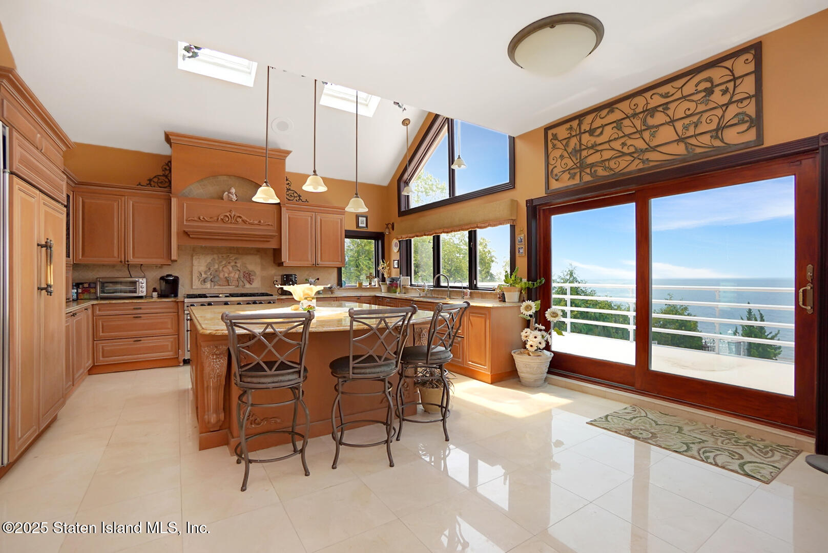 545 Arbutus Avenue Staten Island, NY 10312 - Photo 28 of 57 a dining hall with stainless steel appliances kitchen island granite countertop a stove a sink and a dining table