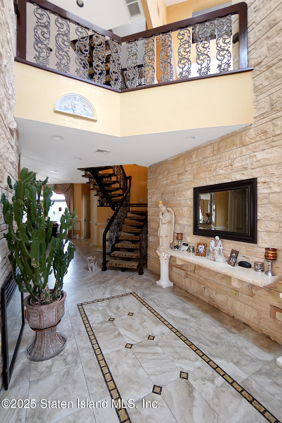 545 Arbutus Avenue Staten Island, NY 10312 - Photo 3 of 57 a living room with furniture and flowers