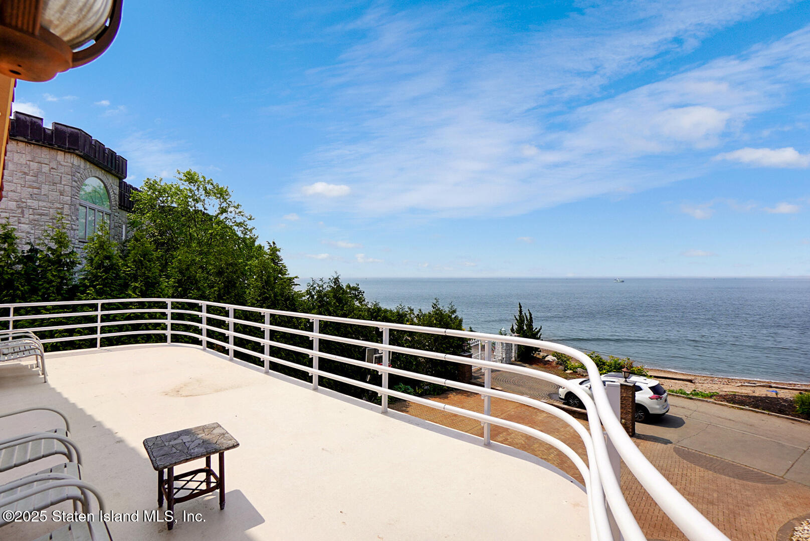545 Arbutus Avenue Staten Island, NY 10312 - Photo 35 of 57 a view of a roof deck with couches and sky view