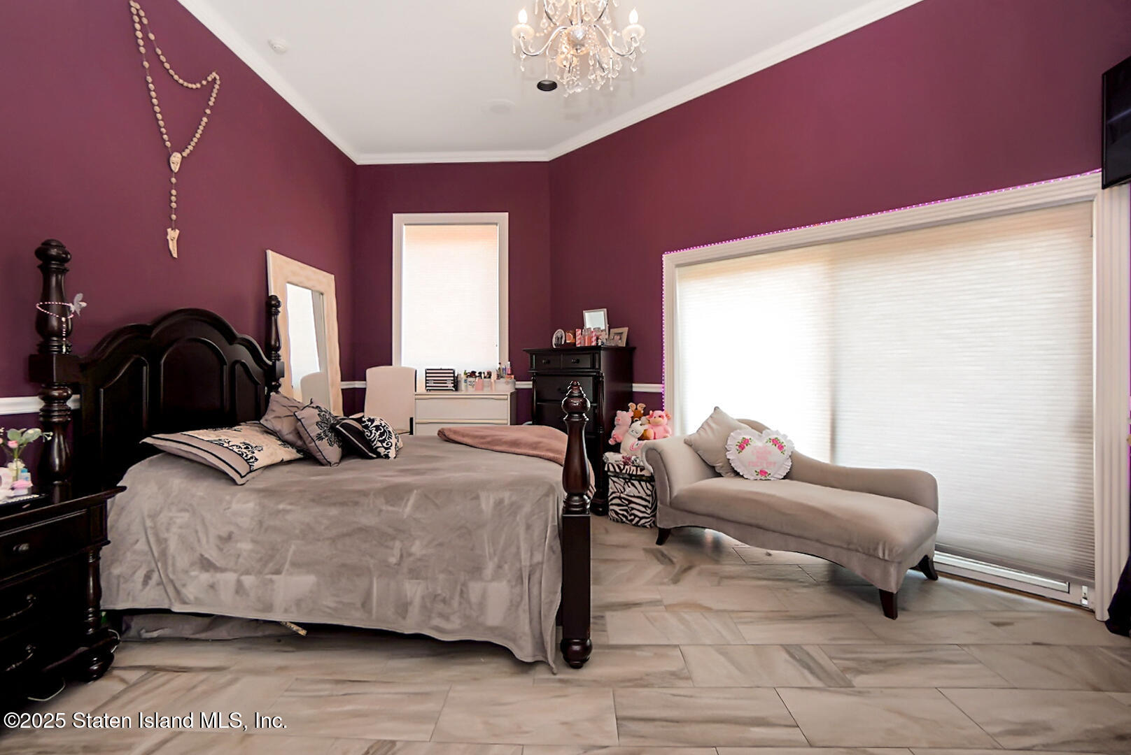 545 Arbutus Avenue Staten Island, NY 10312 - Photo 36 of 57 a bedroom with a bed and a chandelier