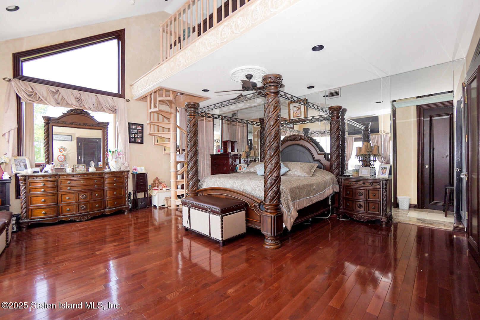 545 Arbutus Avenue Staten Island, NY 10312 - Photo 37 of 57 a bedroom with a bed next to a window with the view of living room