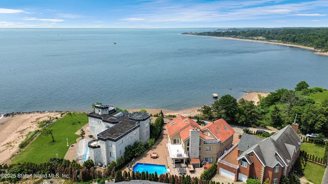 a building outdoor space with patio furniture and potted plants