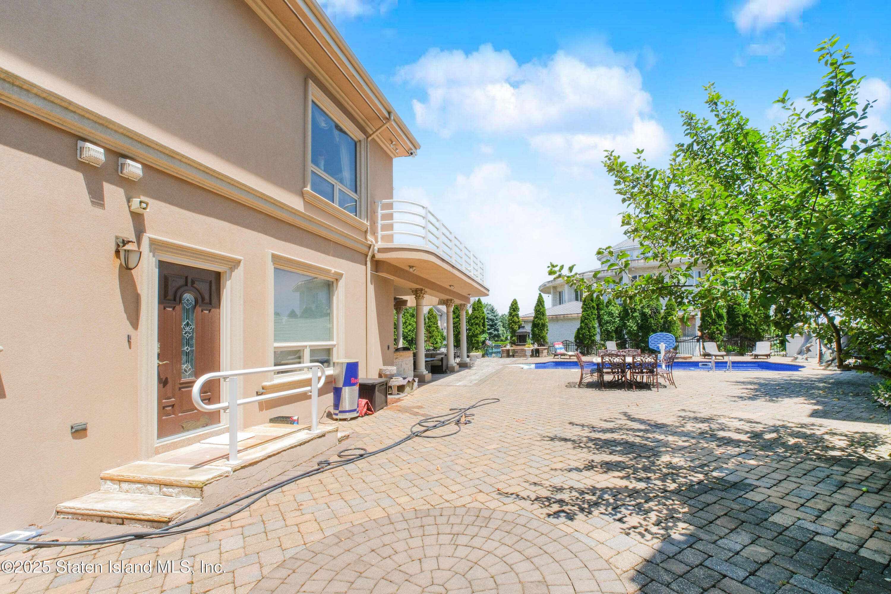545 Arbutus Avenue Staten Island, NY 10312 - Photo 49 of 57 a view of a backyard with a patio
