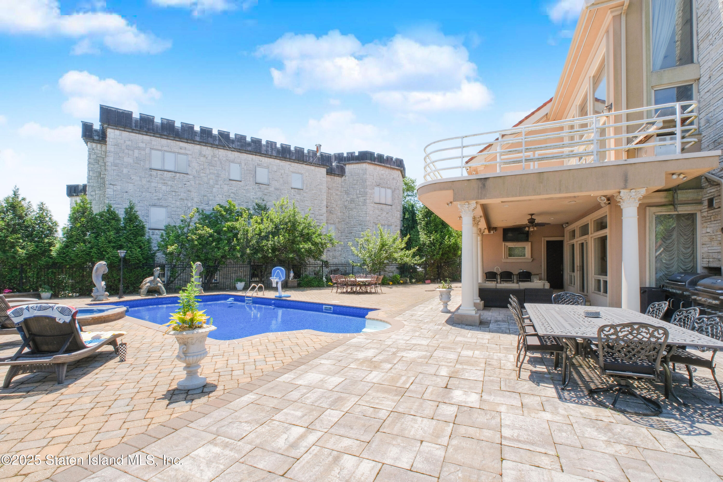 545 Arbutus Avenue Staten Island, NY 10312 - Photo 50 of 57 a view of a patio with swimming pool table and chairs