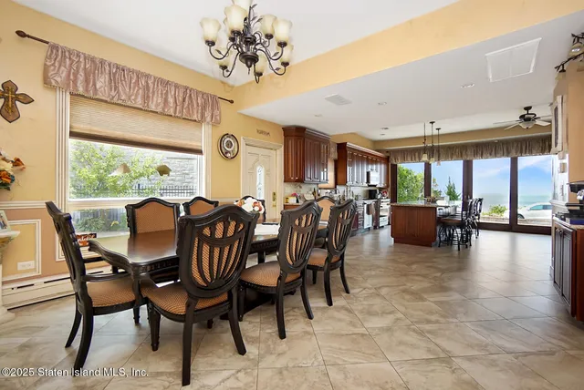 a view of a dining room with furniture window and outside view
