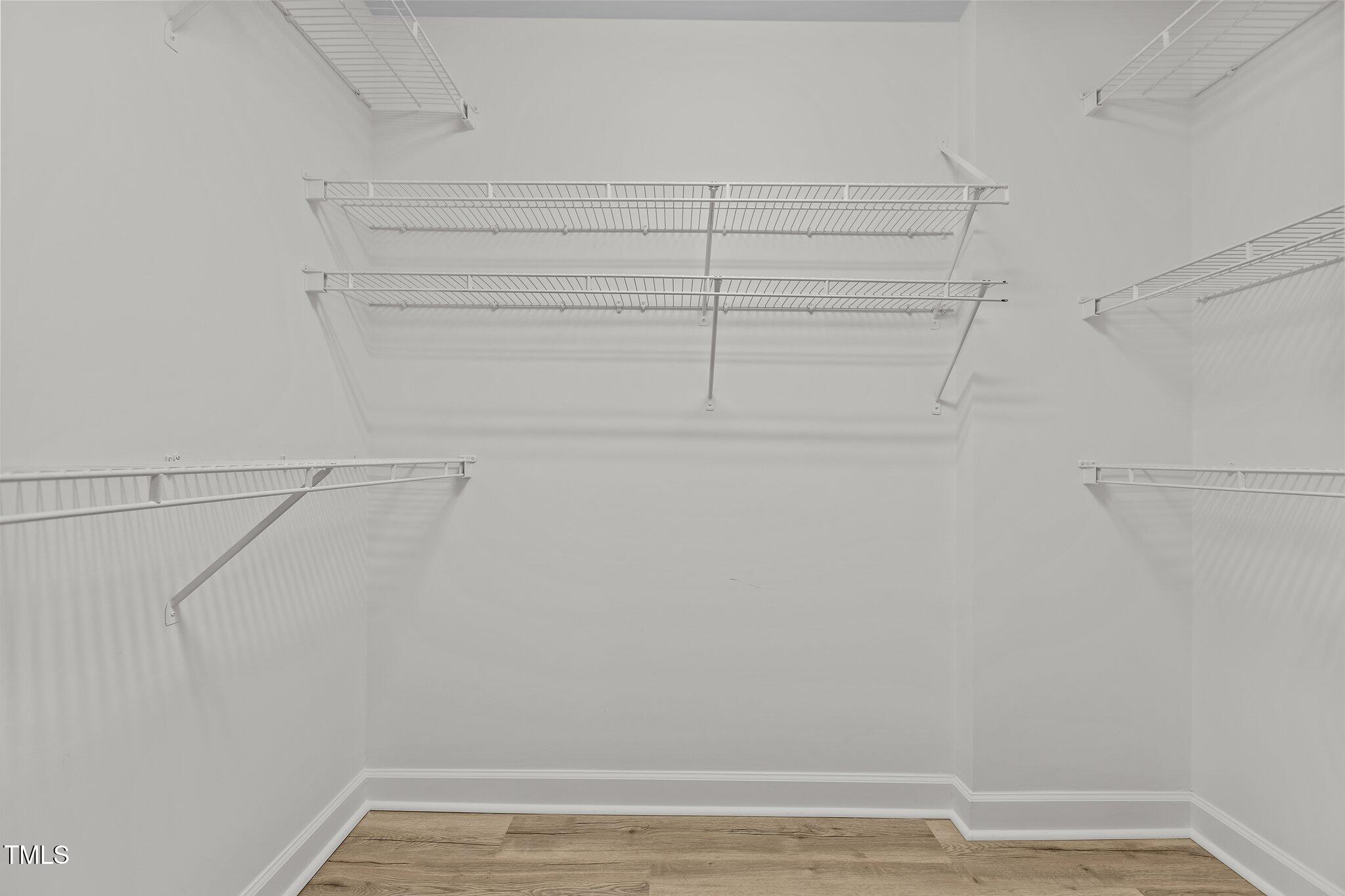 7022 Sandy Forks Road, Unit 101 Raleigh, NC 27615 - Photo 20 of 40 a view of a room with racks on the wall