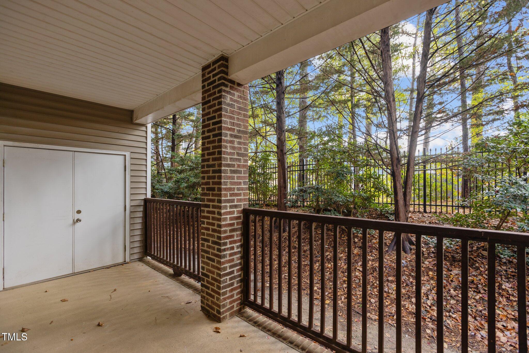 7022 Sandy Forks Road, Unit 101 Raleigh, NC 27615 - Photo 24 of 40 a view of balcony with trees