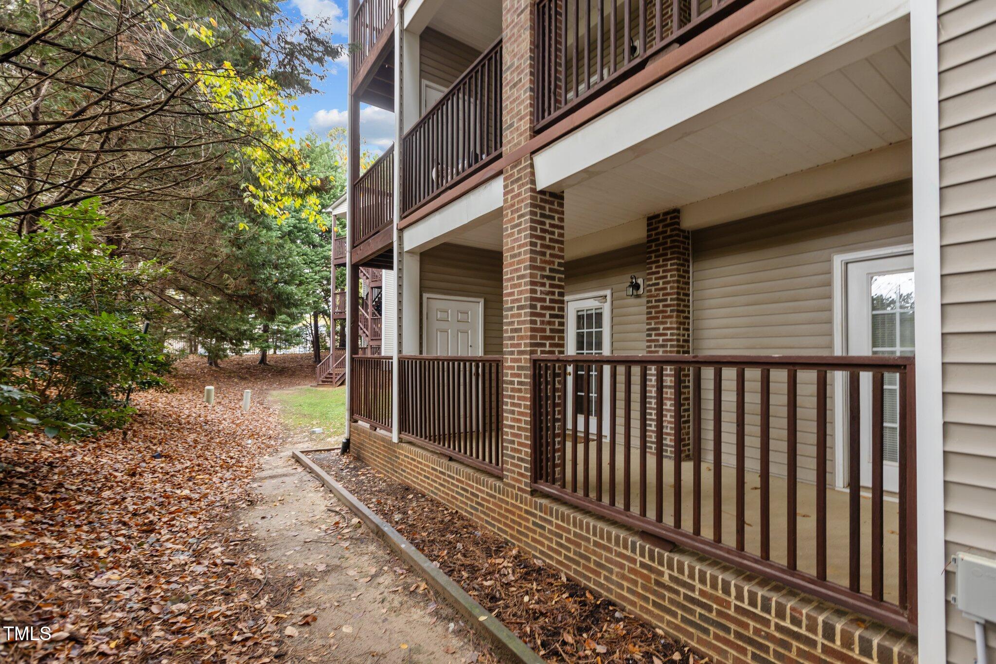 7022 Sandy Forks Road, Unit 101 Raleigh, NC 27615 - Photo 30 of 40 a view of a pathway of a house