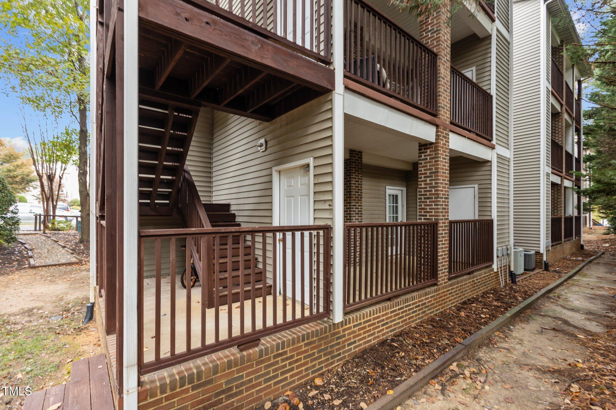 7022 Sandy Forks Road, Unit 101 Raleigh, NC 27615 - Photo 31 of 40 a view of a brick house with a large window