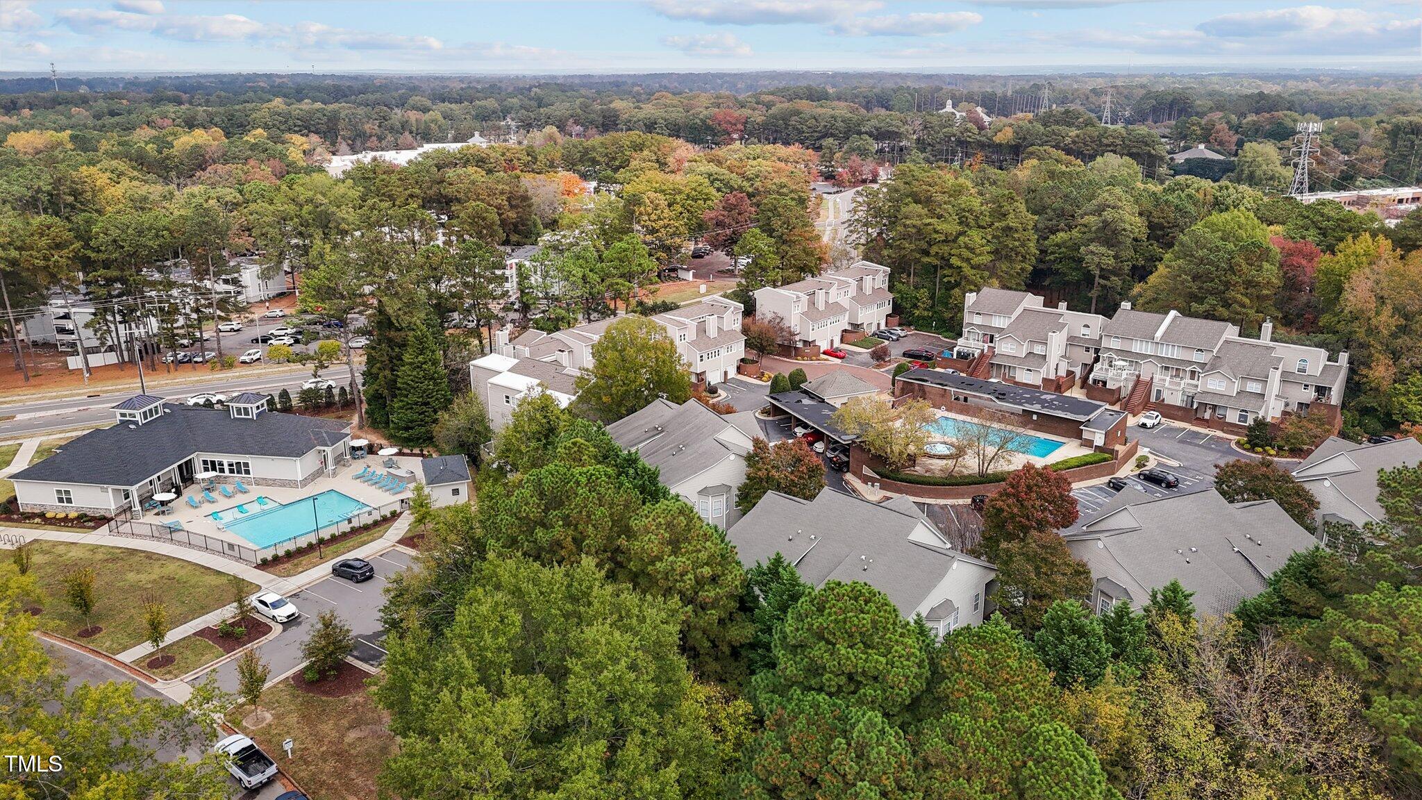7022 Sandy Forks Road, Unit 101 Raleigh, NC 27615 - Photo 35 of 40 an aerial view of a city with lots of residential buildings