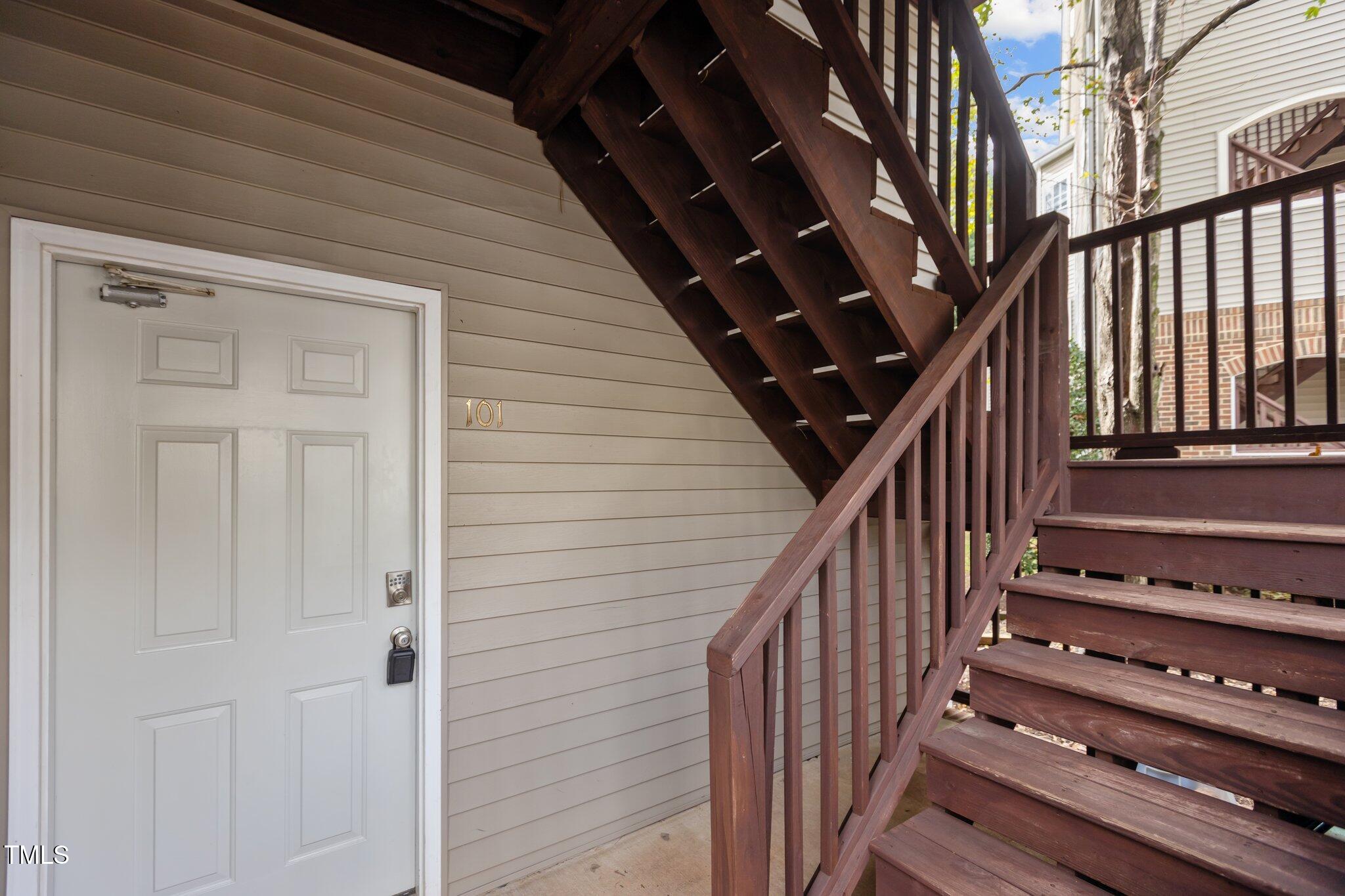 7022 Sandy Forks Road, Unit 101 Raleigh, NC 27615 - Photo 37 of 40 a view of entryway with wooden floor