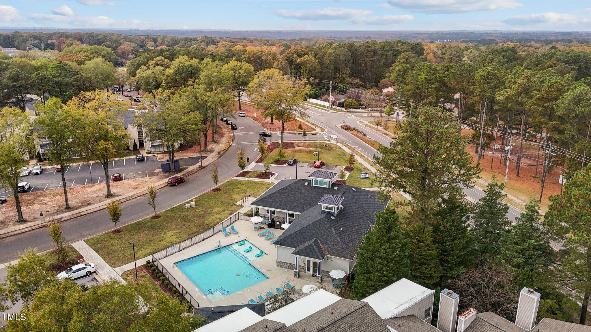 7022 Sandy Forks Road, Unit 101 Raleigh, NC 27615 - Photo 39 of 40 an aerial view of residential houses with outdoor space