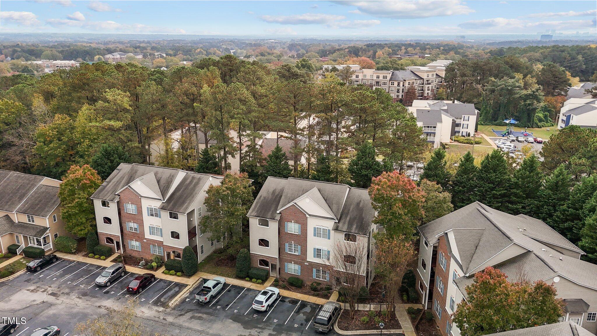 7022 Sandy Forks Road, Unit 101 Raleigh, NC 27615 - Photo 5 of 40 an aerial view of multiple house