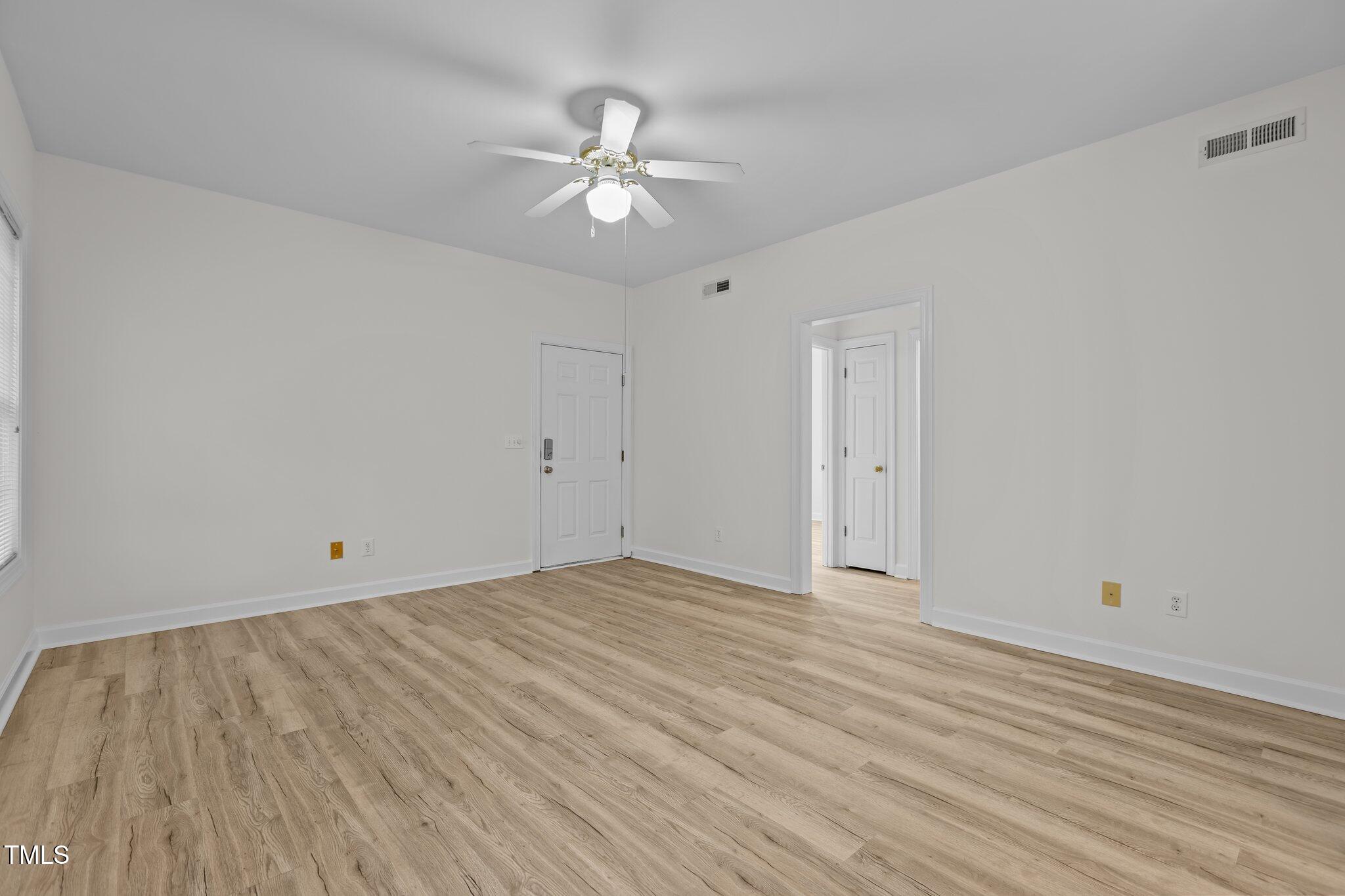 7022 Sandy Forks Road, Unit 101 Raleigh, NC 27615 - Photo 9 of 40 wooden floor in an empty room