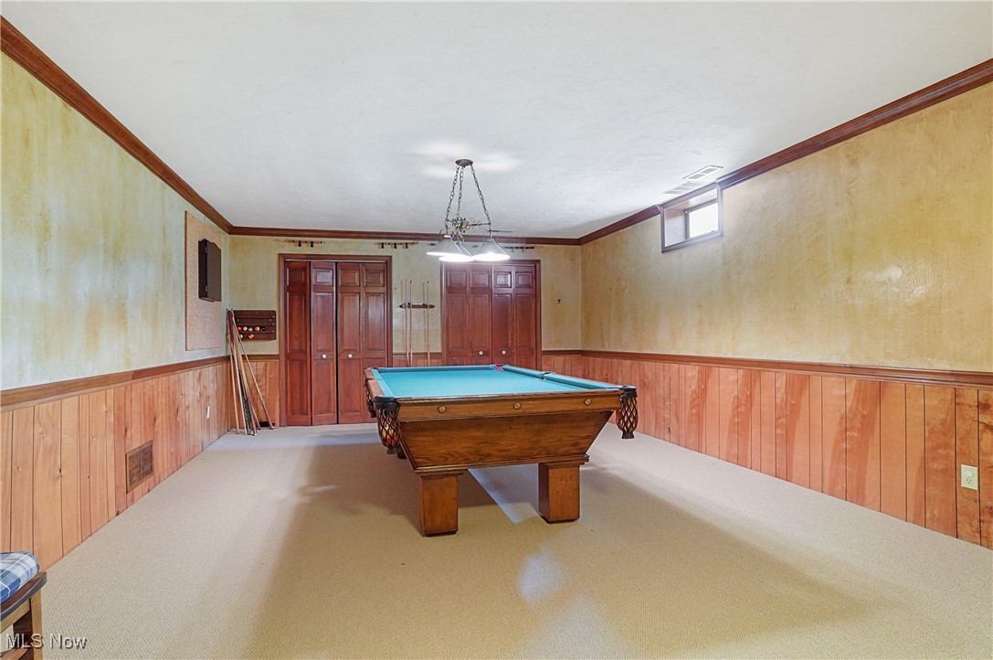 4432 Ira Road Akron, OH 44333 - Photo 38 of 50 Game room with wooden walls, wainscoting, carpet floors, pool table, and ornamental molding