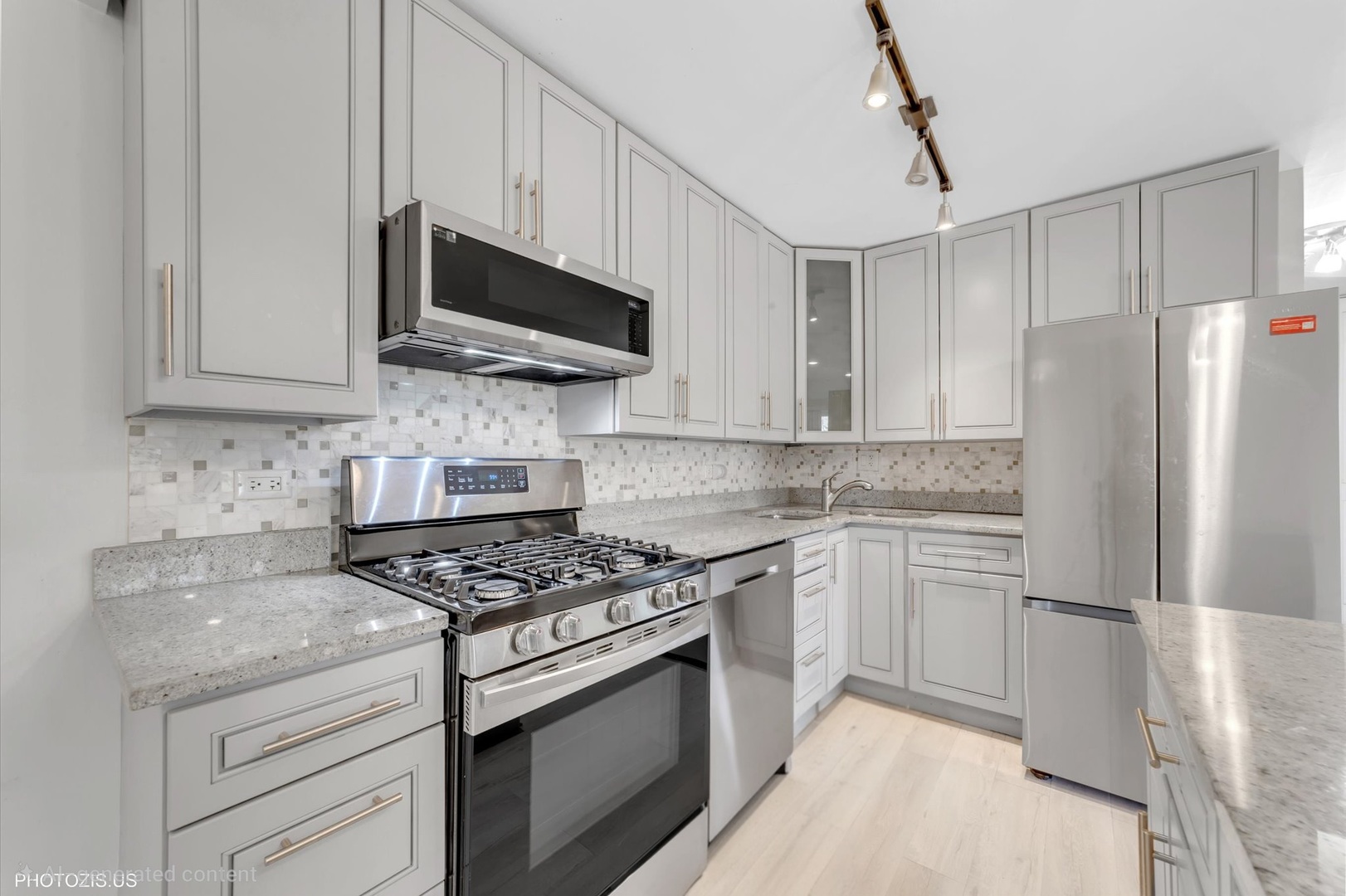 1126 South New Wilke Road, Unit 307 Arlington Heights, IL 60005 - Photo 11 of 37 a kitchen with stainless steel appliances granite countertop a stove a refrigerator and a microwave