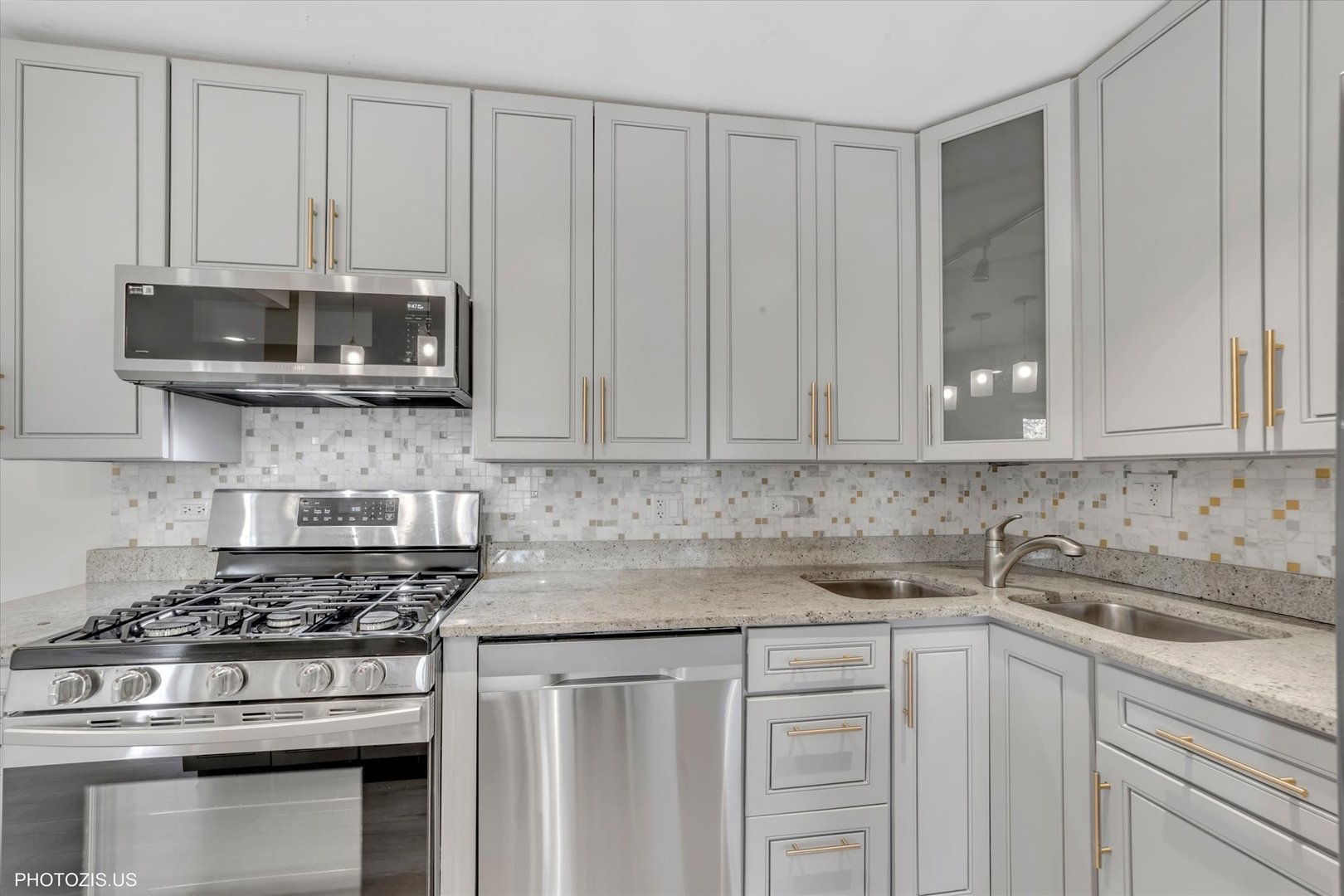 1126 South New Wilke Road, Unit 307 Arlington Heights, IL 60005 - Photo 12 of 37 a kitchen with stainless steel appliances granite countertop a stove a microwave and cabinets