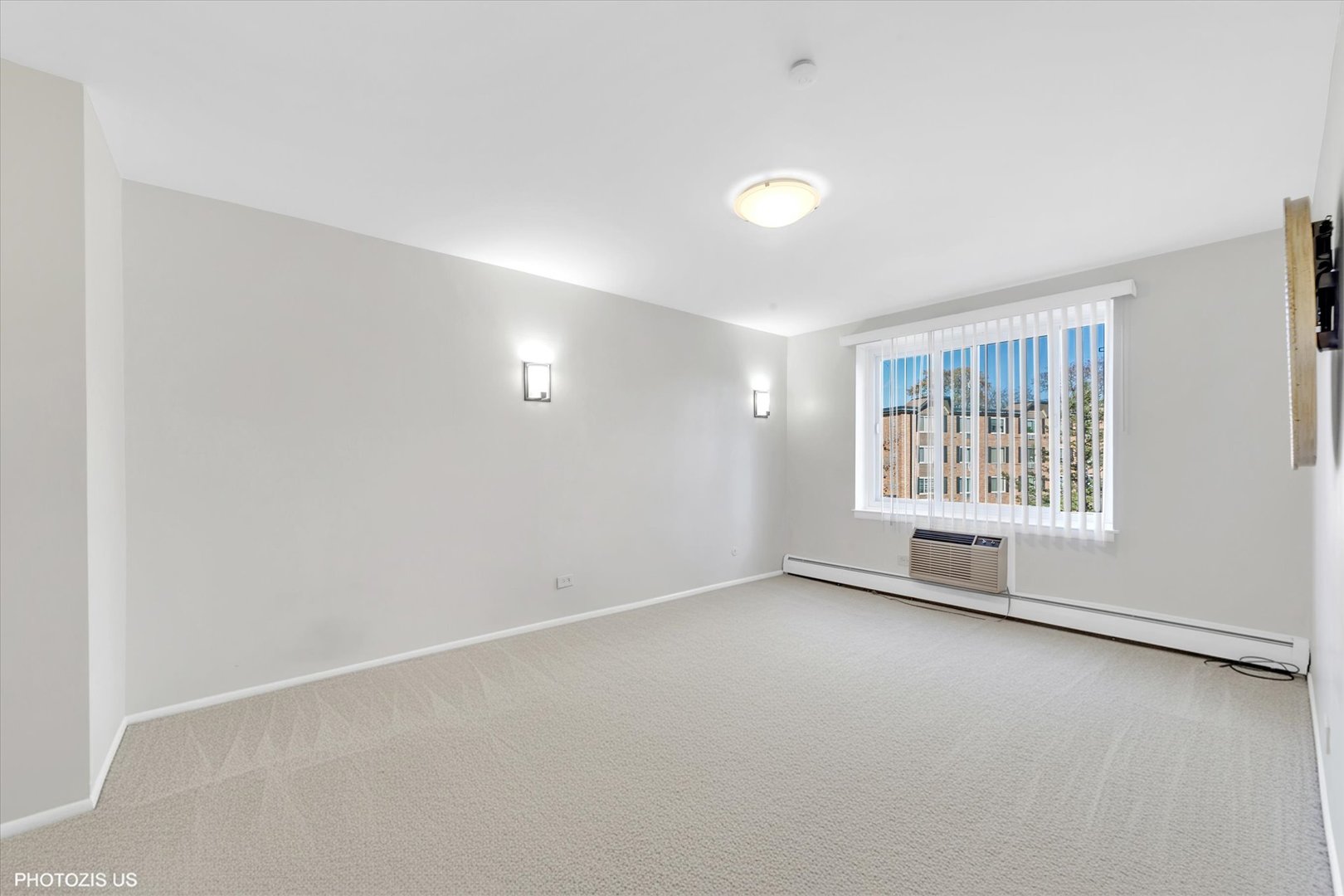 1126 South New Wilke Road, Unit 307 Arlington Heights, IL 60005 - Photo 14 of 37 an empty room with windows
