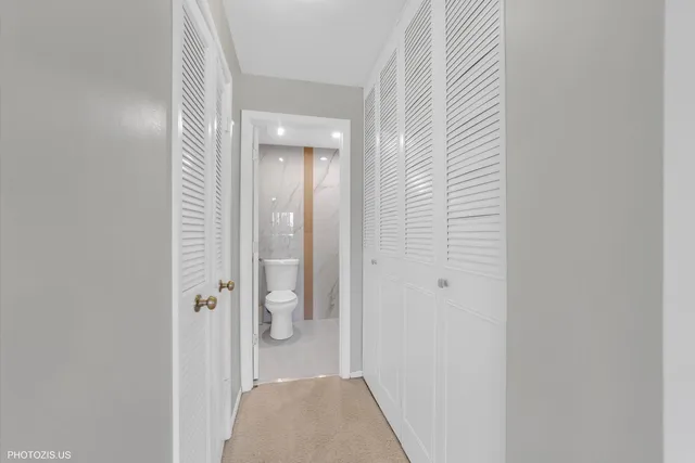 a view of a bathroom from a hallway