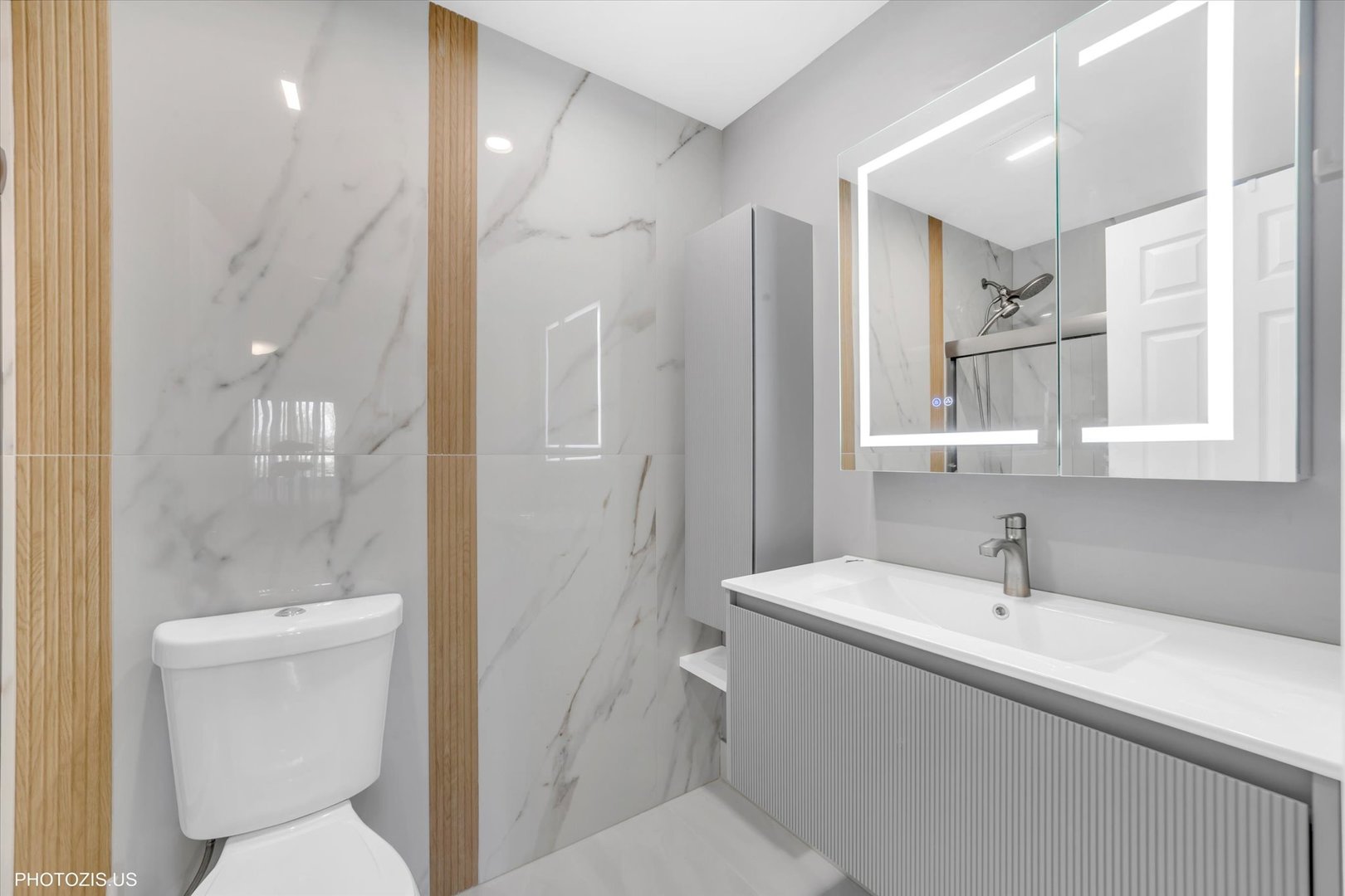 1126 South New Wilke Road, Unit 307 Arlington Heights, IL 60005 - Photo 18 of 37 a bathroom with a sink a toilet and shower