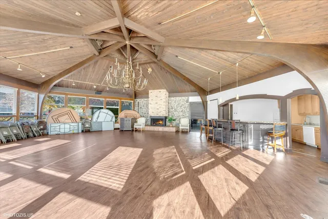 a living room with lots of furniture and a large window