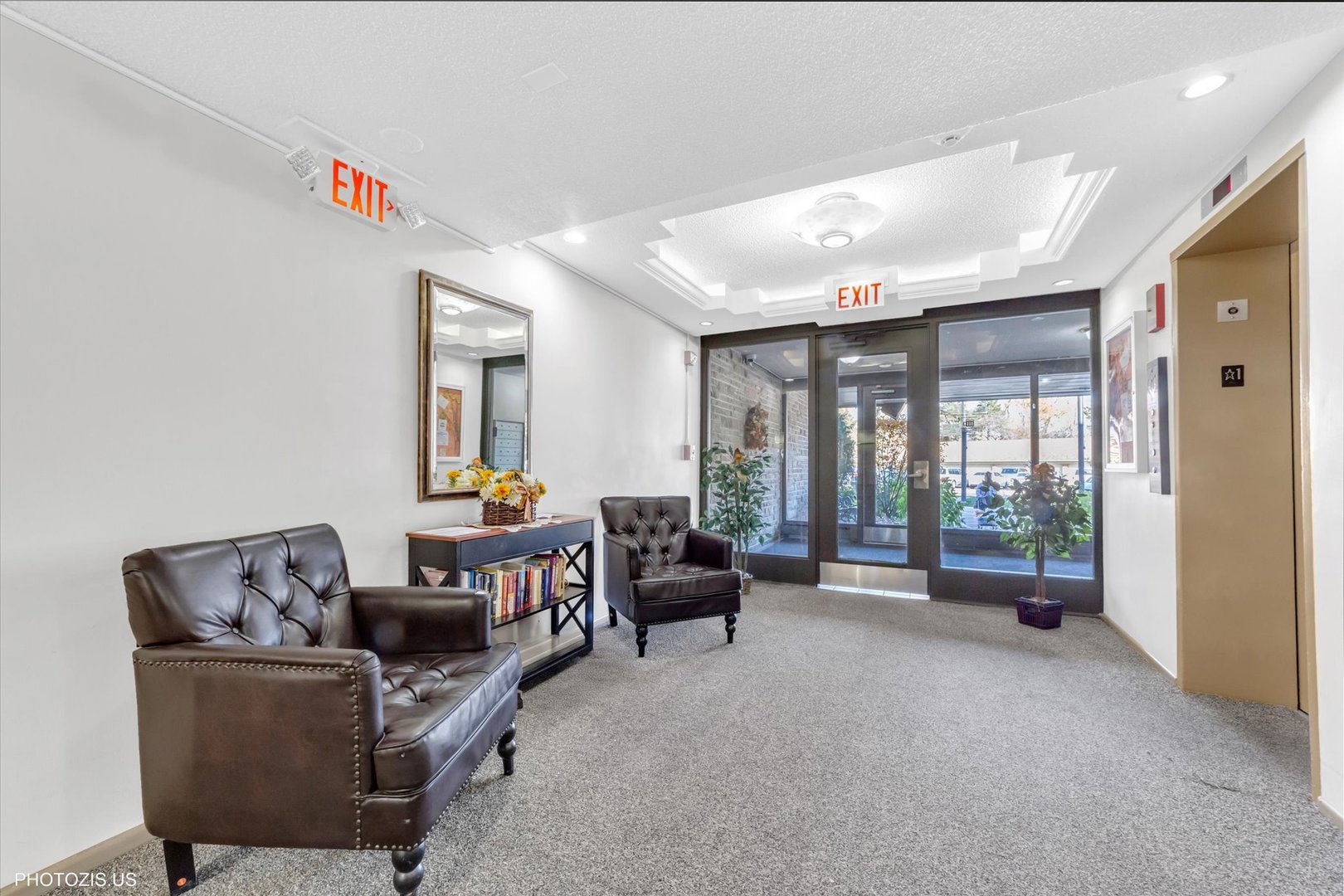 1126 South New Wilke Road, Unit 307 Arlington Heights, IL 60005 - Photo 27 of 37 a living room with furniture and large windows