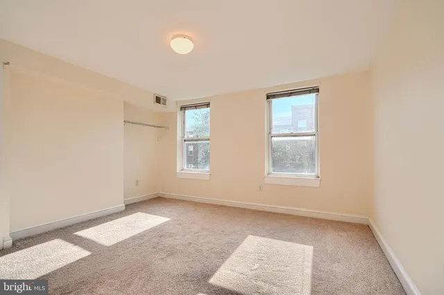 an empty room with windows