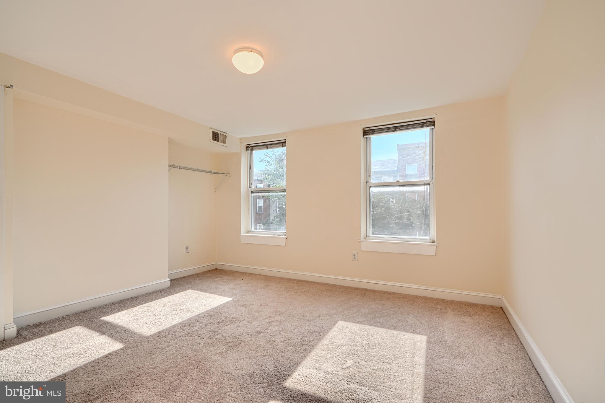 229 South Ann Street, Unit B Baltimore, MD 21231 - Photo 13 of 47 an empty room with windows