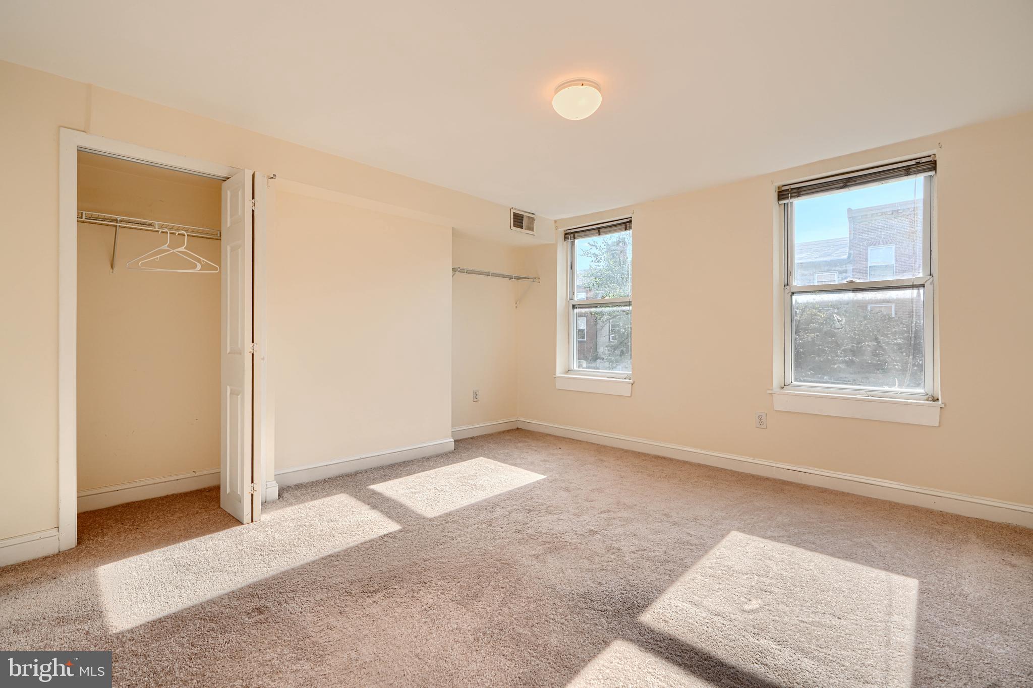 229 South Ann Street, Unit B Baltimore, MD 21231 - Photo 14 of 47 an empty room with windows and closet
