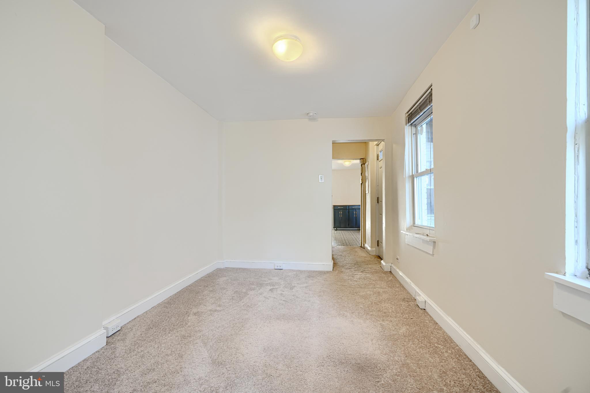 229 South Ann Street, Unit B Baltimore, MD 21231 - Photo 19 of 47 a view of an empty room with a window