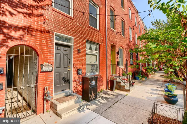 a front view of a building with an outdoor seating