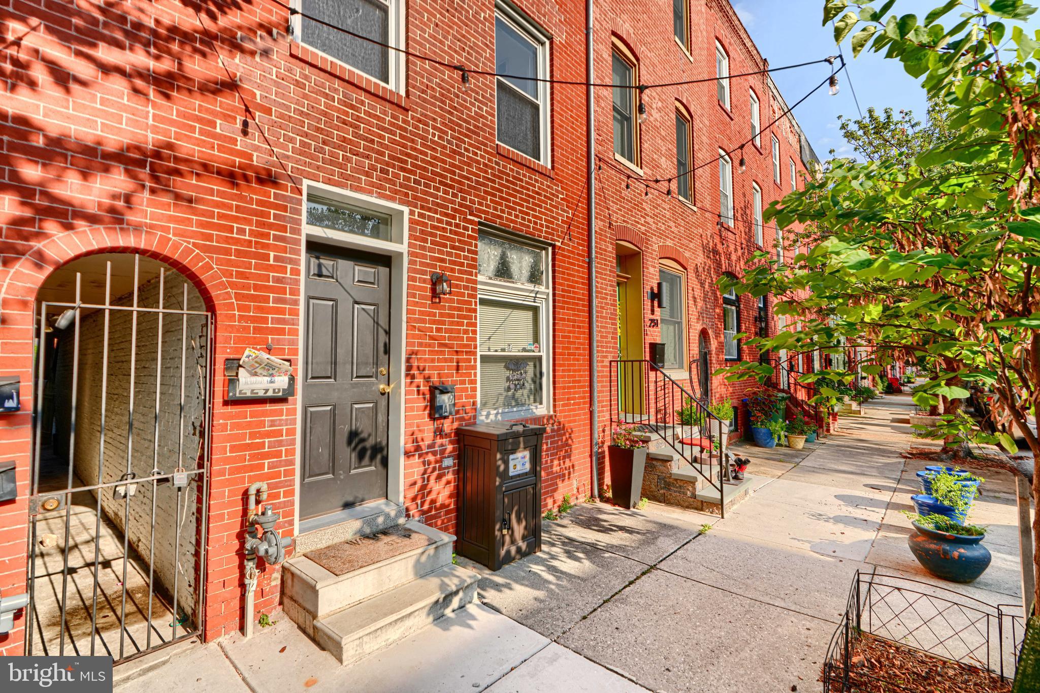 229 South Ann Street, Unit B Baltimore, MD 21231 - Photo 2 of 47 a front view of a building with an outdoor seating