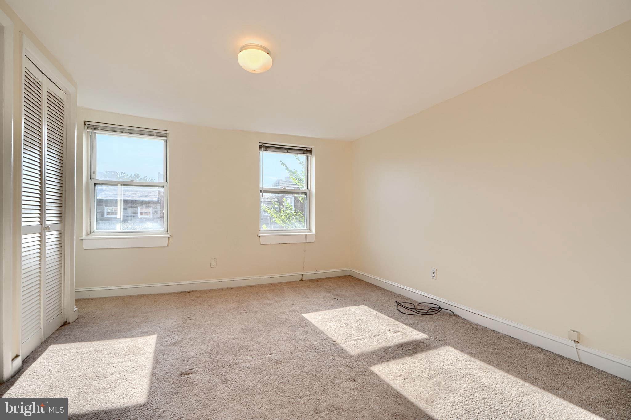 229 South Ann Street, Unit B Baltimore, MD 21231 - Photo 26 of 47 an empty room with windows