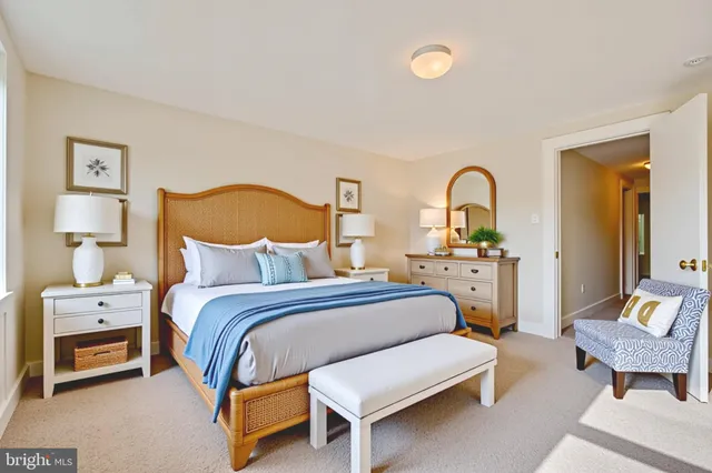 a bedroom with a bed and a lamp on table