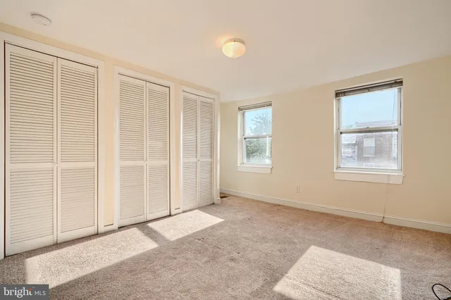 an empty room with windows