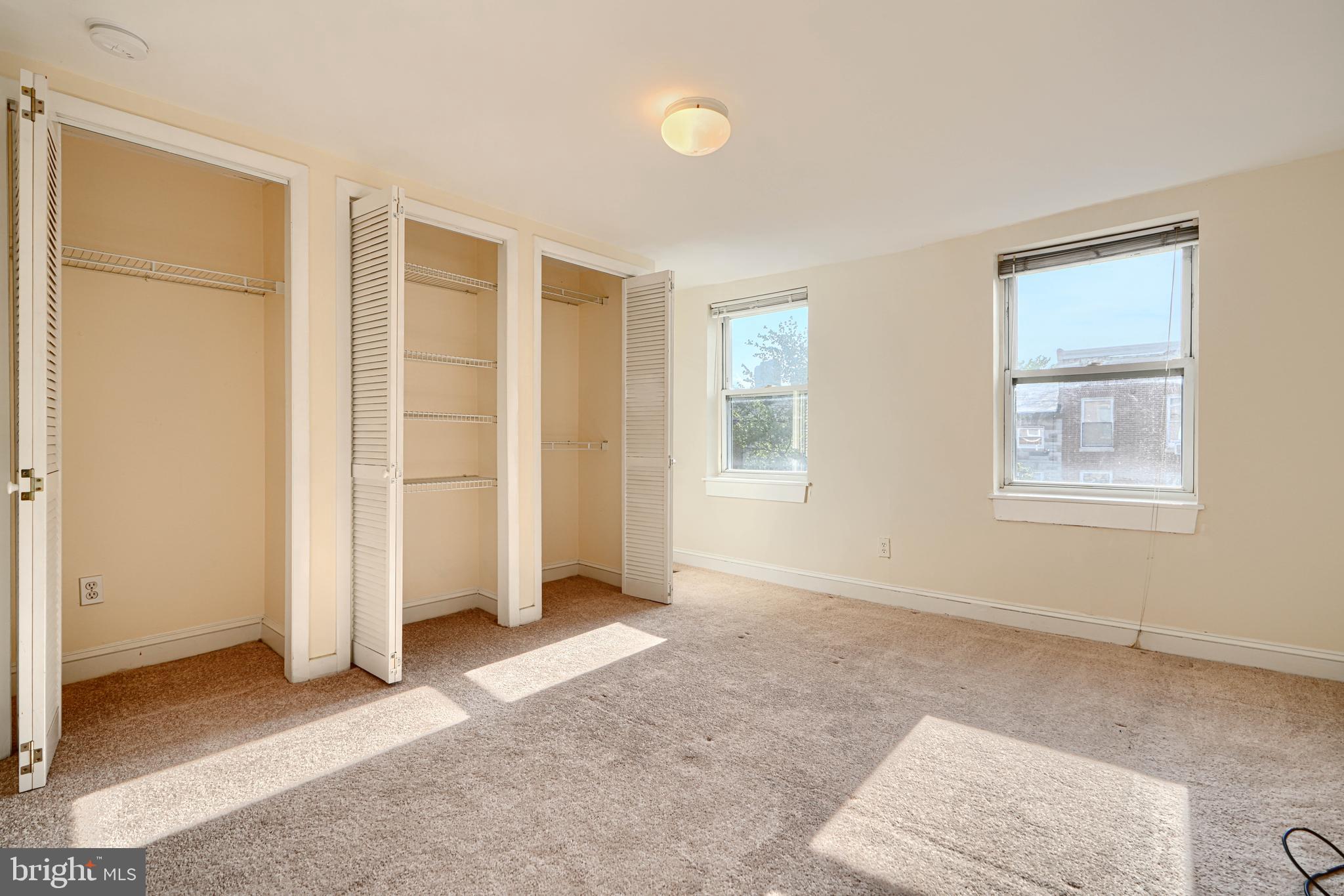 229 South Ann Street, Unit B Baltimore, MD 21231 - Photo 32 of 47 an empty room with windows