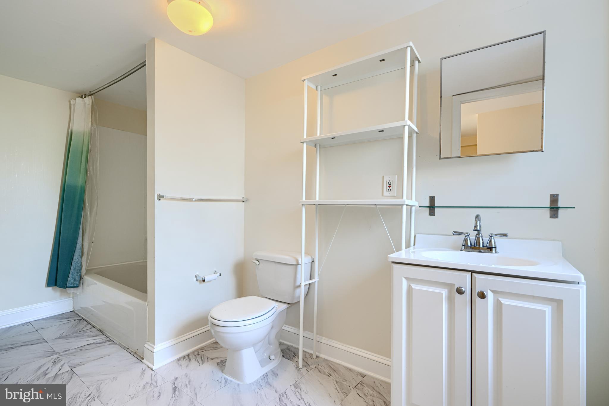 229 South Ann Street, Unit B Baltimore, MD 21231 - Photo 34 of 47 a bathroom with a granite countertop sink toilet and shower