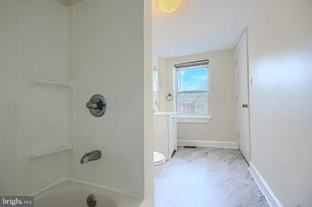 a view of balcony and wooden floor