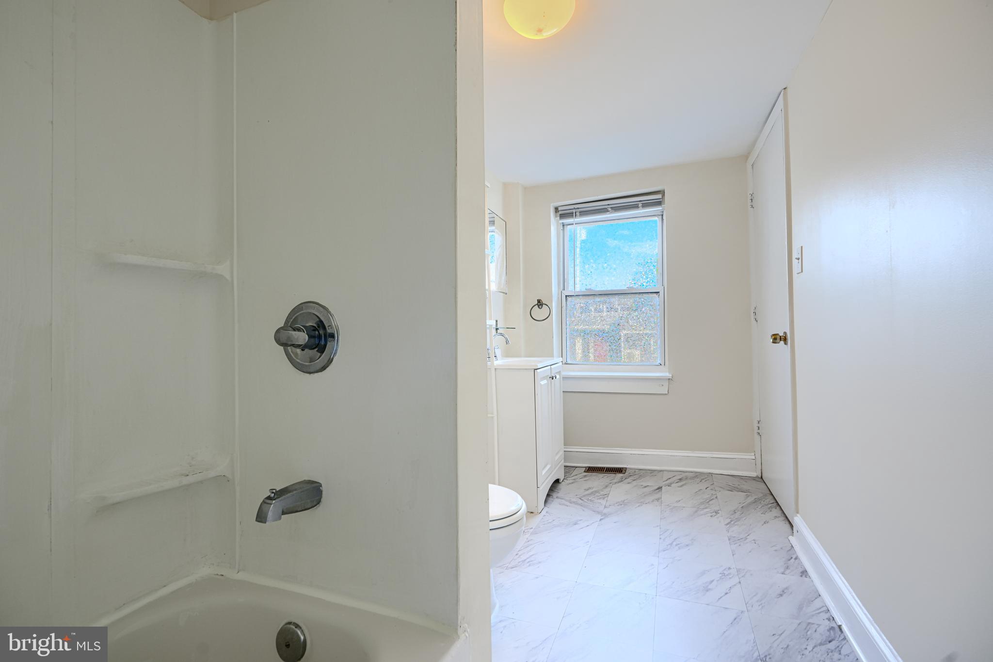 229 South Ann Street, Unit B Baltimore, MD 21231 - Photo 36 of 47 a view of an empty room with a window