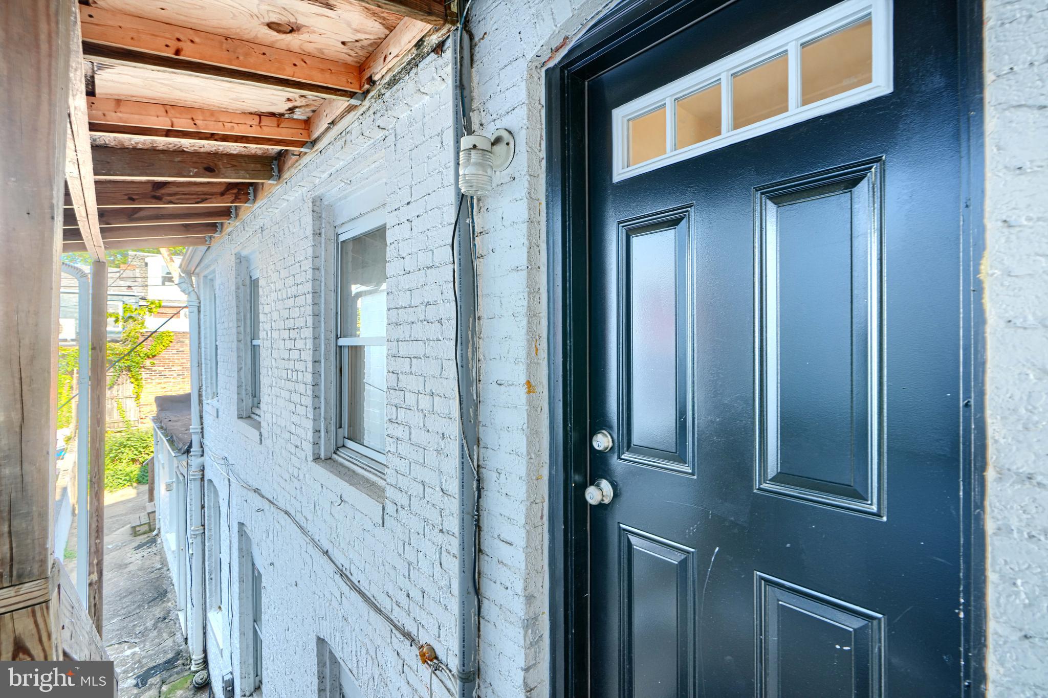 229 South Ann Street, Unit B Baltimore, MD 21231 - Photo 37 of 47 a view of balcony and wooden floor