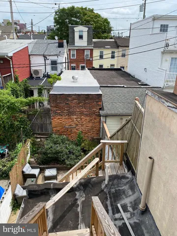 a view of a house with wooden deck