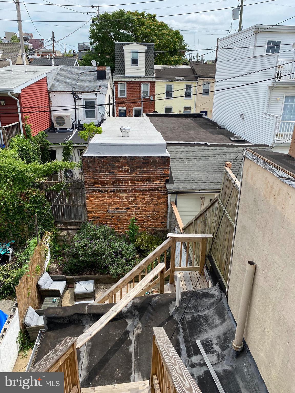 229 South Ann Street, Unit B Baltimore, MD 21231 - Photo 41 of 47 a view of a patio with table and chairs a barbeque